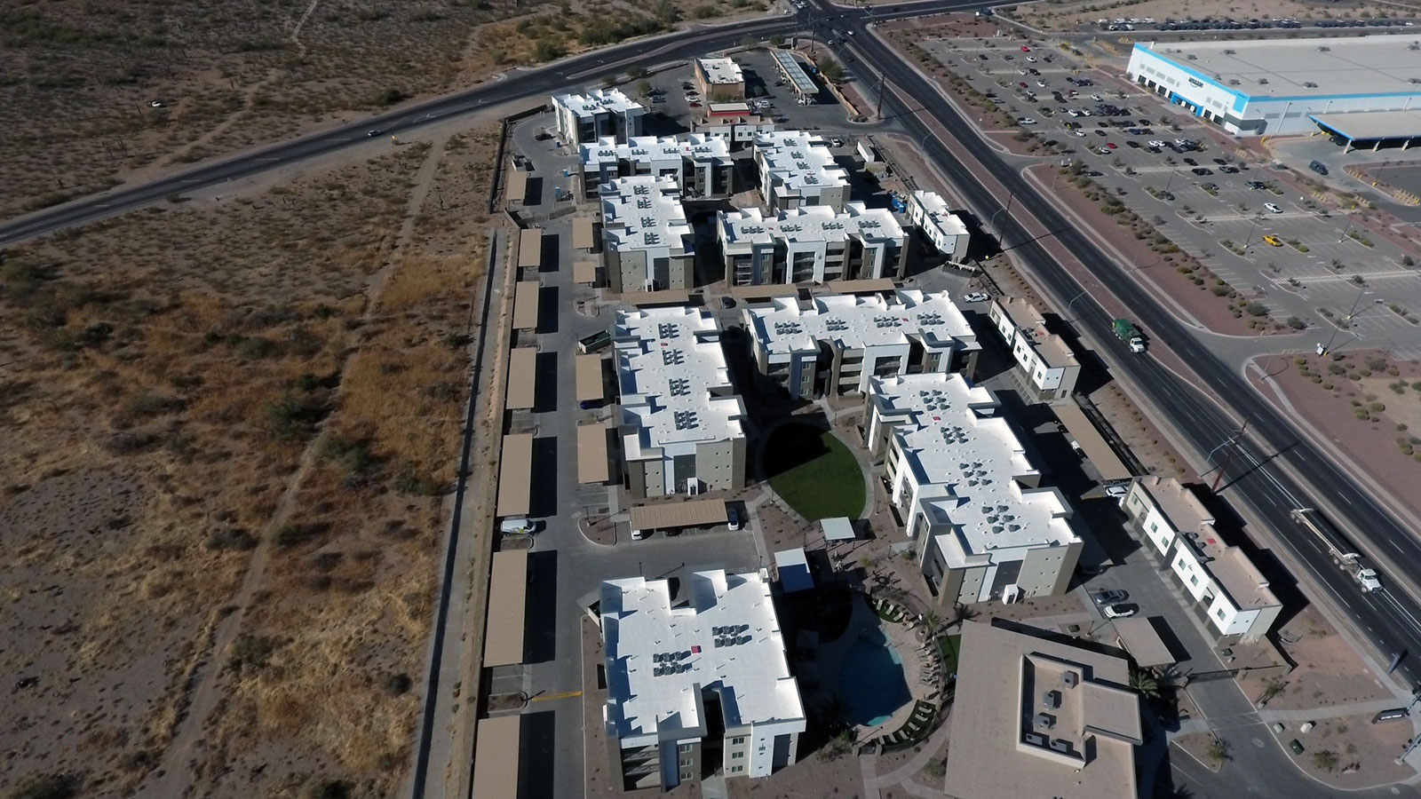 Aerial view of multiple commercial foam roofs on an Arizona property complex Aerial view of multiple commercial foam roofs on an Arizona property complex